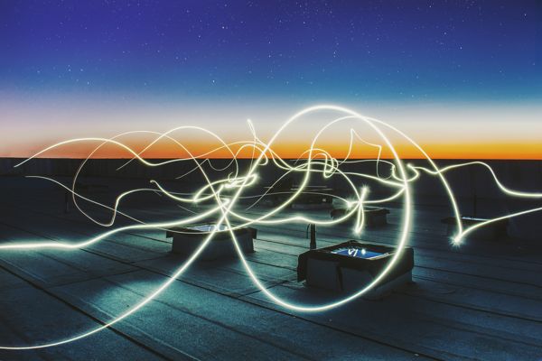 electric waves moving on dark sky